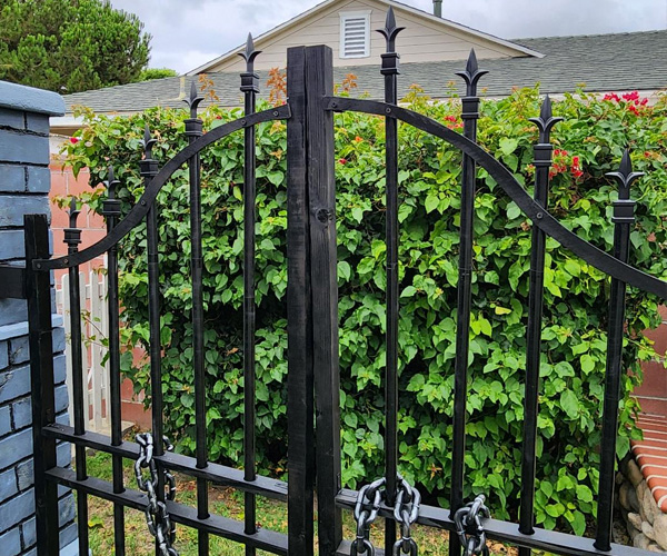 Installing the first arch on the cemetery gate.