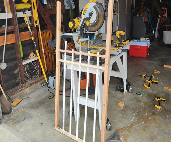 Adding vertical bars to the cemetery gate.